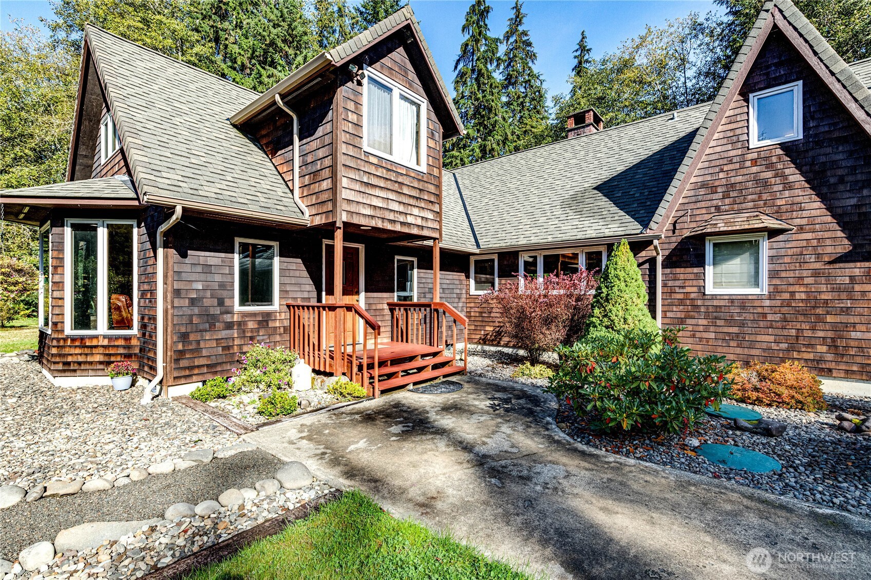 107 Dowan Creek Road Forks, WA 98331 - Photo 5 of 40 a front view of a house with garden
