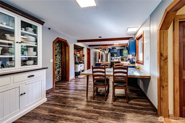 a view of a dining room with furniture and window