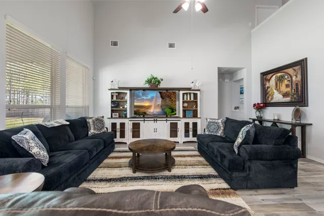 a living room with furniture and a window