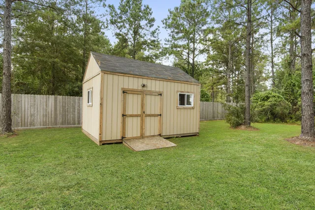 a view of backyard with trampoline