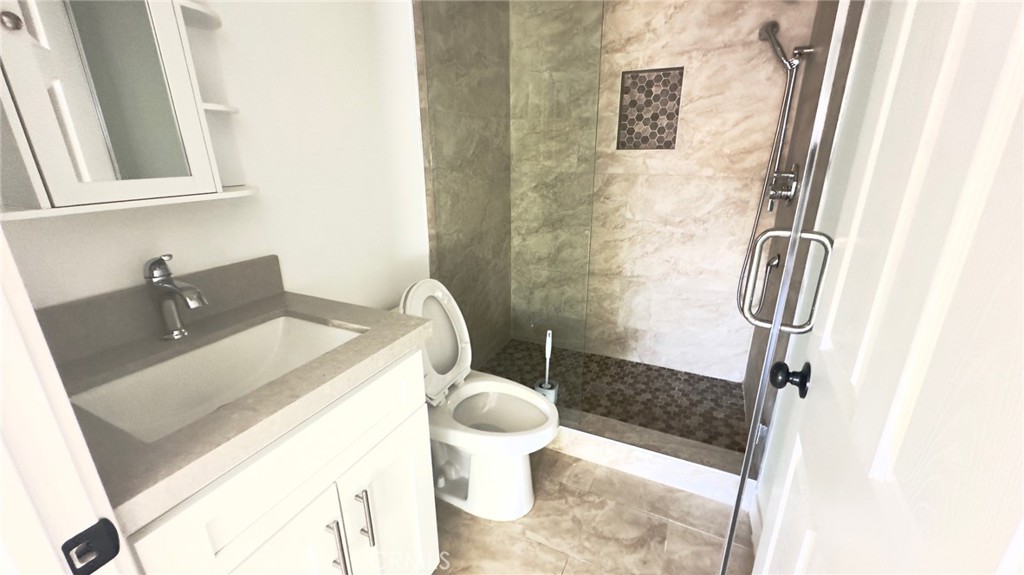 1565 1/2 Atchison Street Pasadena, CA 91104 - Photo 4 of 10 a bathroom with a sink and toilet