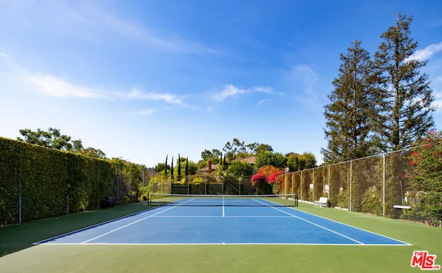 a view of an outdoor space and tennis court