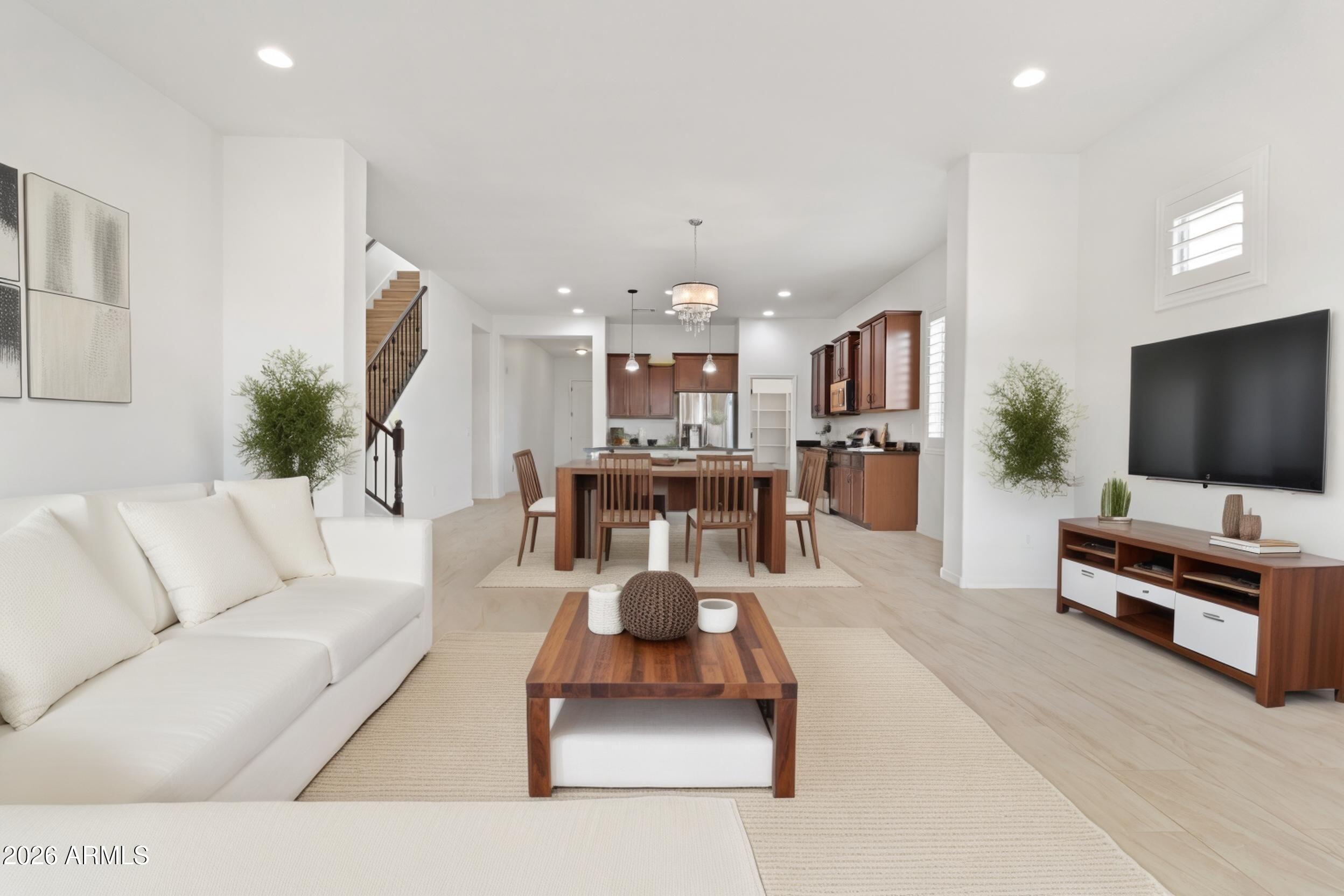 20537 West Valley View Drive Buckeye, AZ 85396 - Photo 11 of 32 a living room with furniture and a flat screen tv