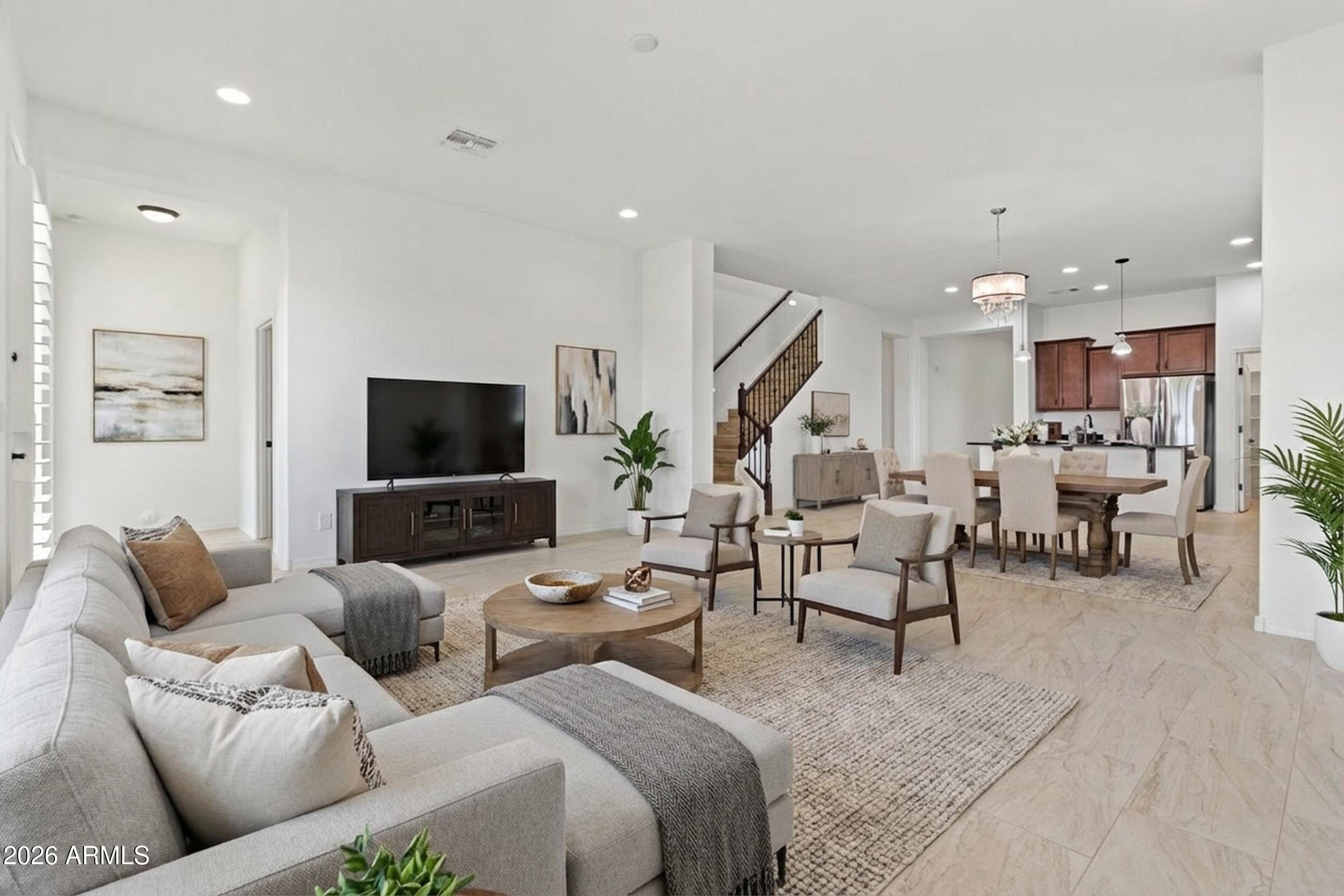 20537 West Valley View Drive Buckeye, AZ 85396 - Photo 12 of 32 a living room with furniture and a flat screen tv