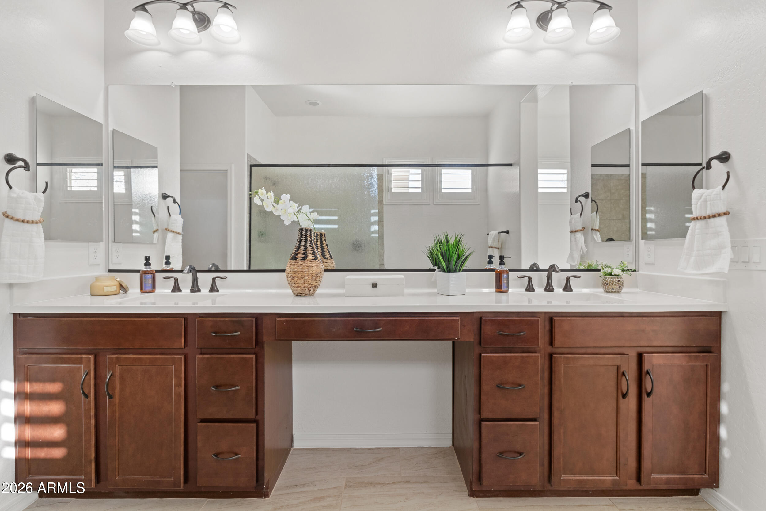20537 West Valley View Drive Buckeye, AZ 85396 - Photo 15 of 32 a bathroom with a sink and a large mirror
