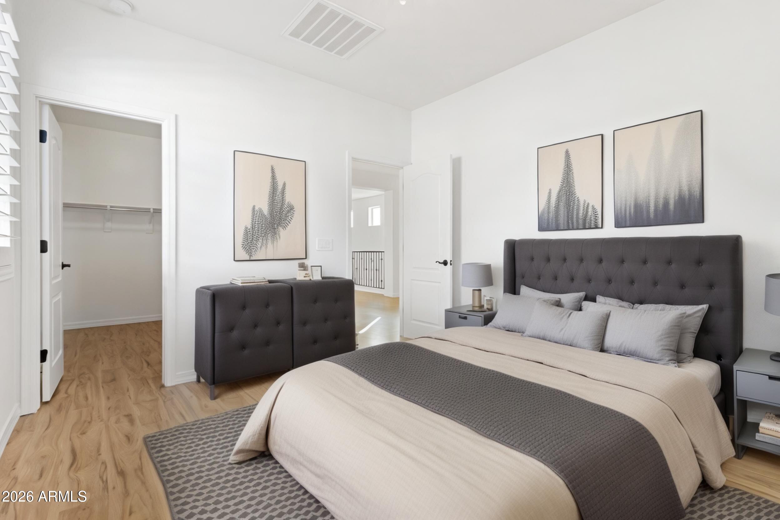 20537 West Valley View Drive Buckeye, AZ 85396 - Photo 19 of 32 a bedroom with a bed and wooden floor