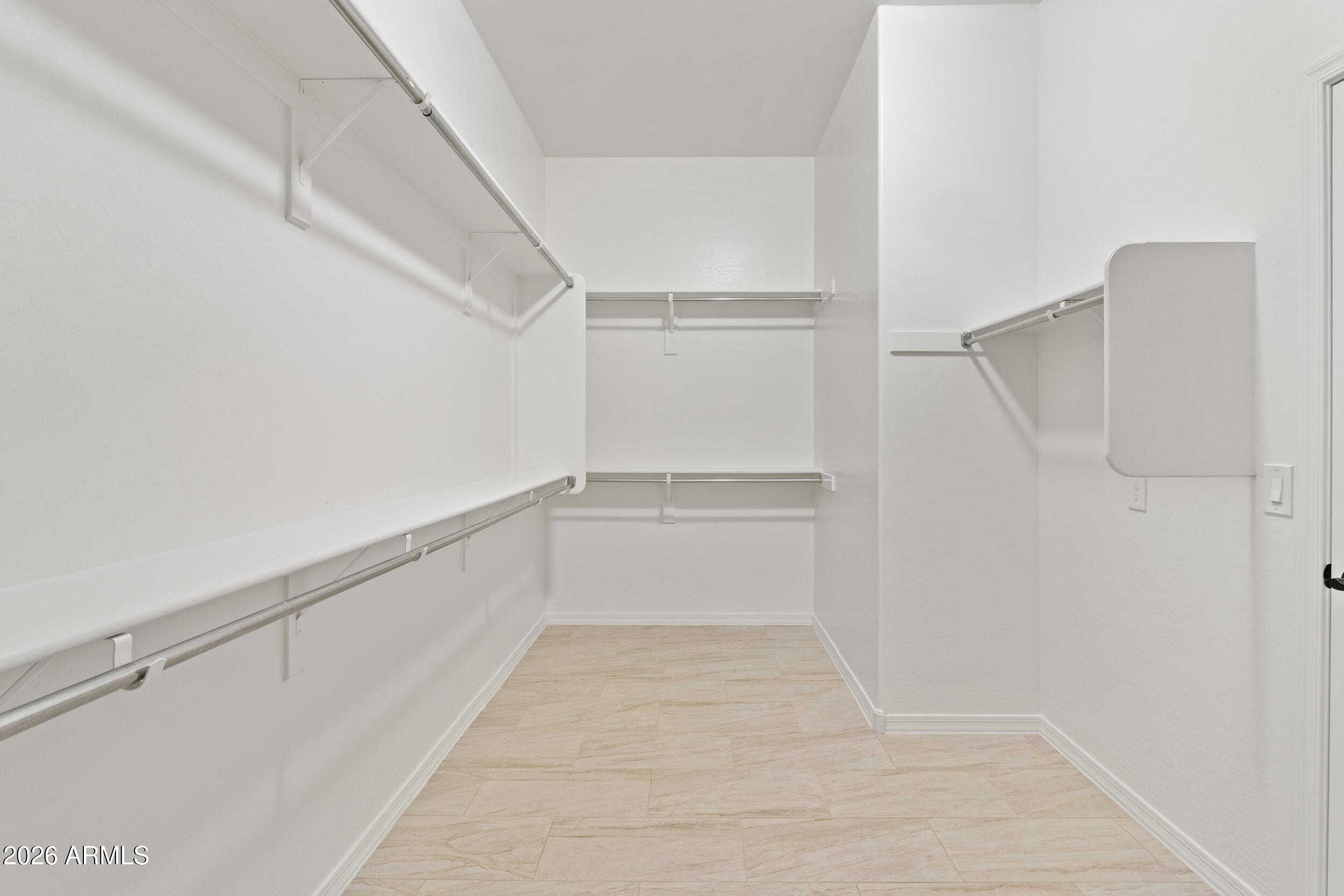 20537 West Valley View Drive Buckeye, AZ 85396 - Photo 22 of 32 a view of walk in closet with empty racks