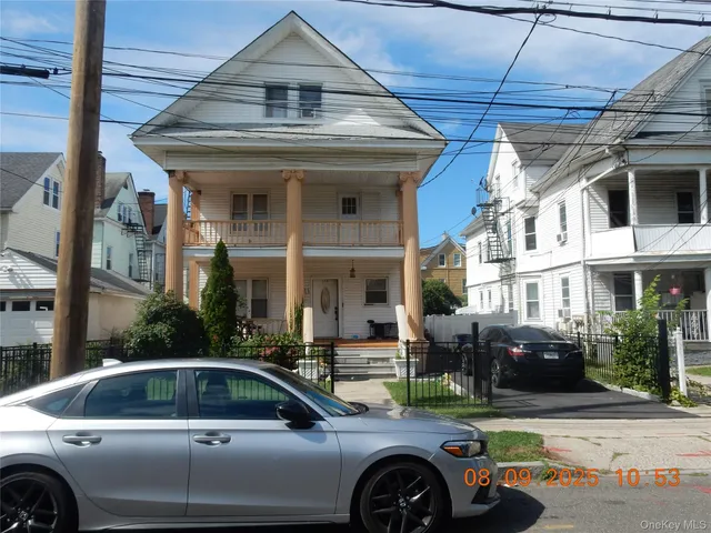 a view of a car parked in front of a building