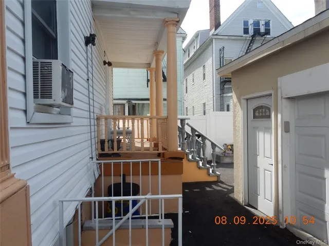 a view of a balcony with wooden floor and stairs