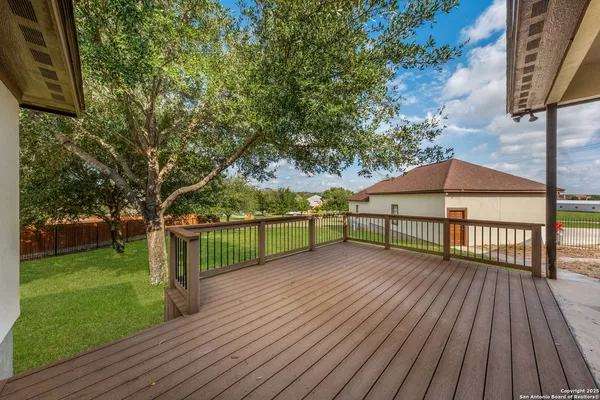 a view of a deck with a yard