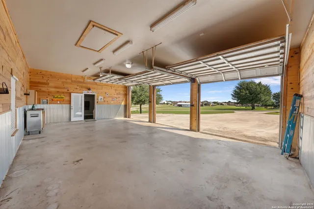 a view of a hall with wooden floor