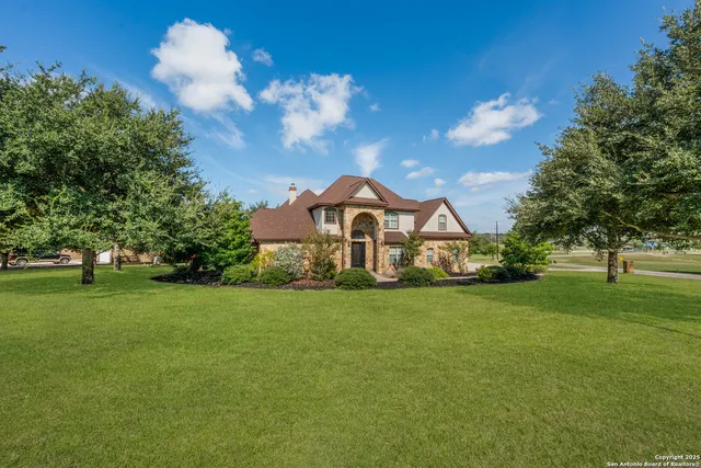 a view of a house with a big yard