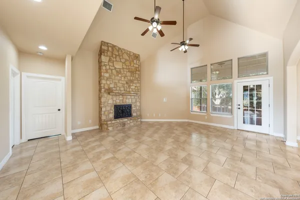 a view of an empty room with a fireplace
