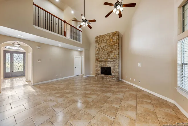 a view of an empty room with a fireplace