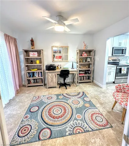 a living room with fireplace furniture and a flat screen tv