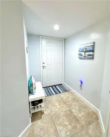 a bedroom with a bed and a table in it