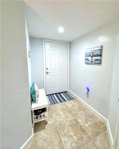 a bedroom with a bed and a table in it