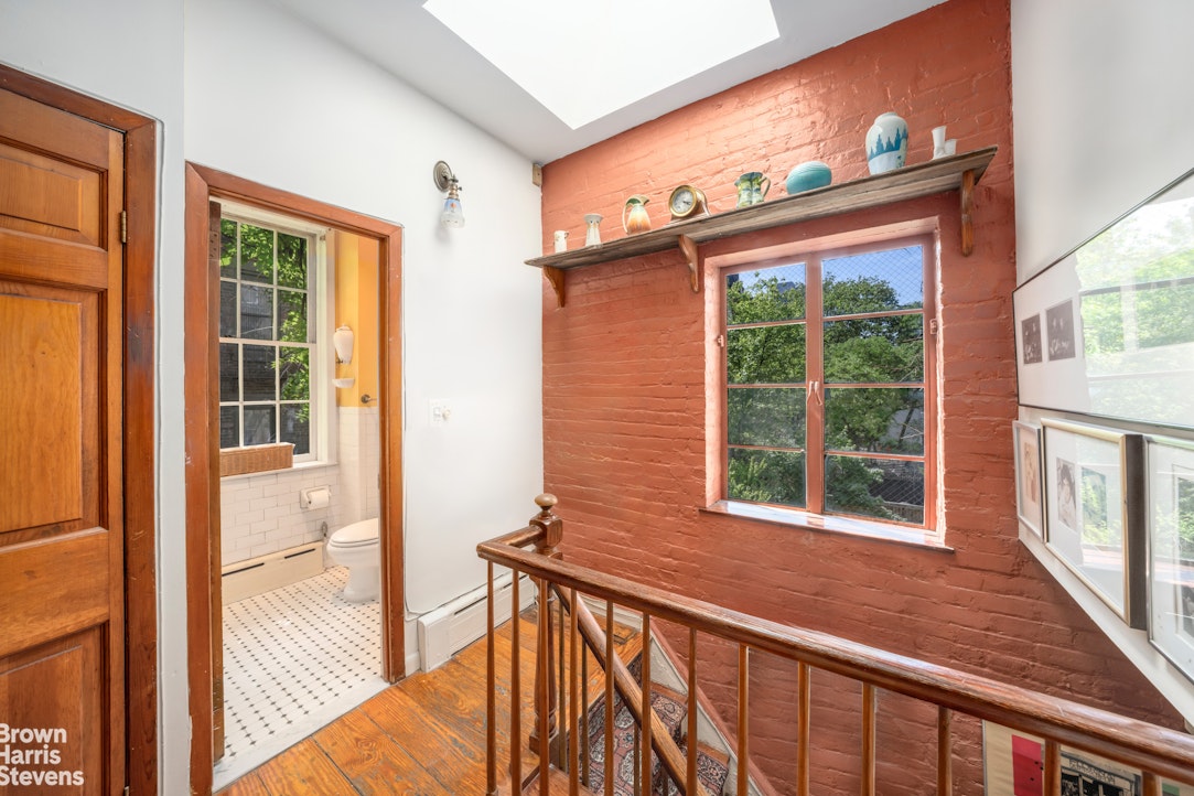 422 West 46th Street, Unit 2R Manhattan, NY 10036 - Photo 9 of 10 a view of a house with large windows