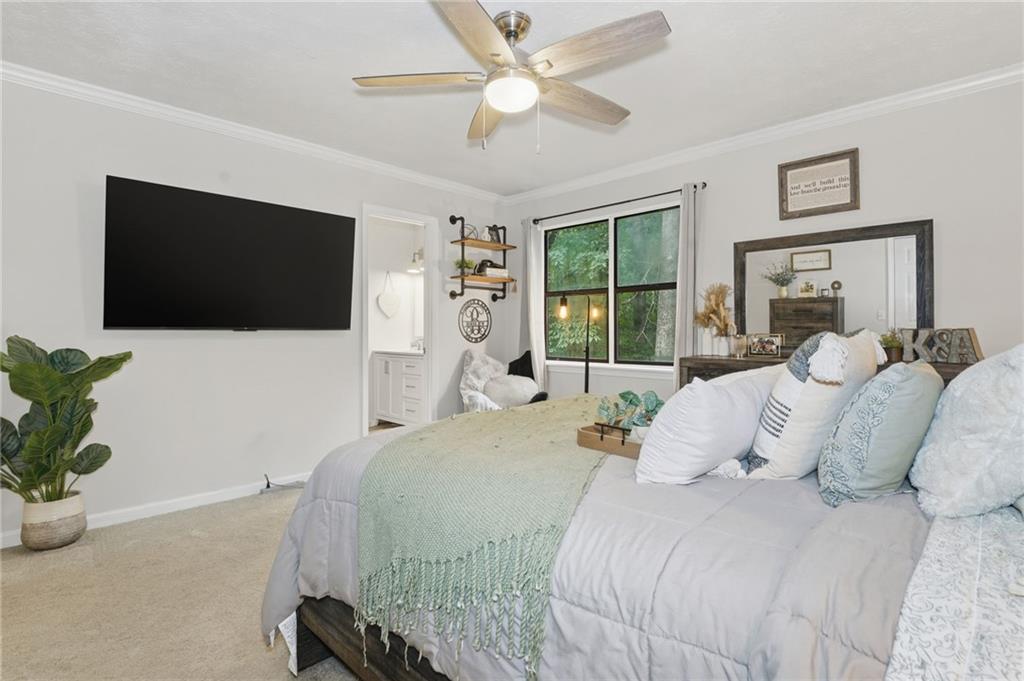 404 Brooks Street Dallas, GA 30157 - Photo 15 of 38 a bedroom with a bed and a flat screen tv