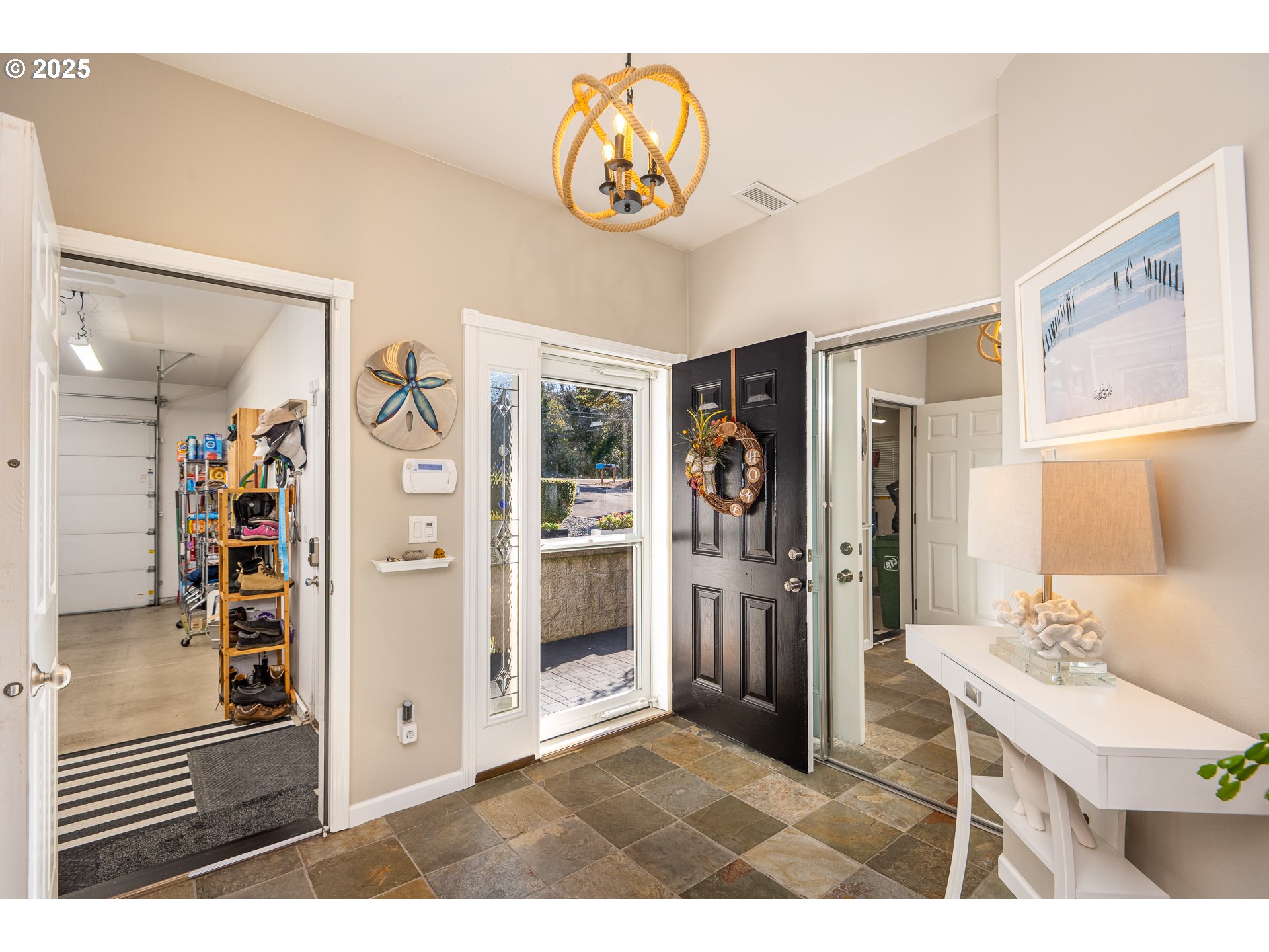 3315 Rhododendron Drive Florence, OR 97439 - Photo 16 of 48 a kitchen with stainless steel appliances kitchen island granite countertop a refrigerator and a sink