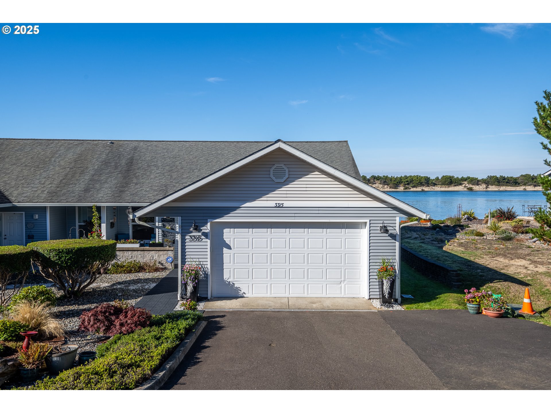 3315 Rhododendron Drive Florence, OR 97439 - Photo 2 of 48 a front view of a house with a yard