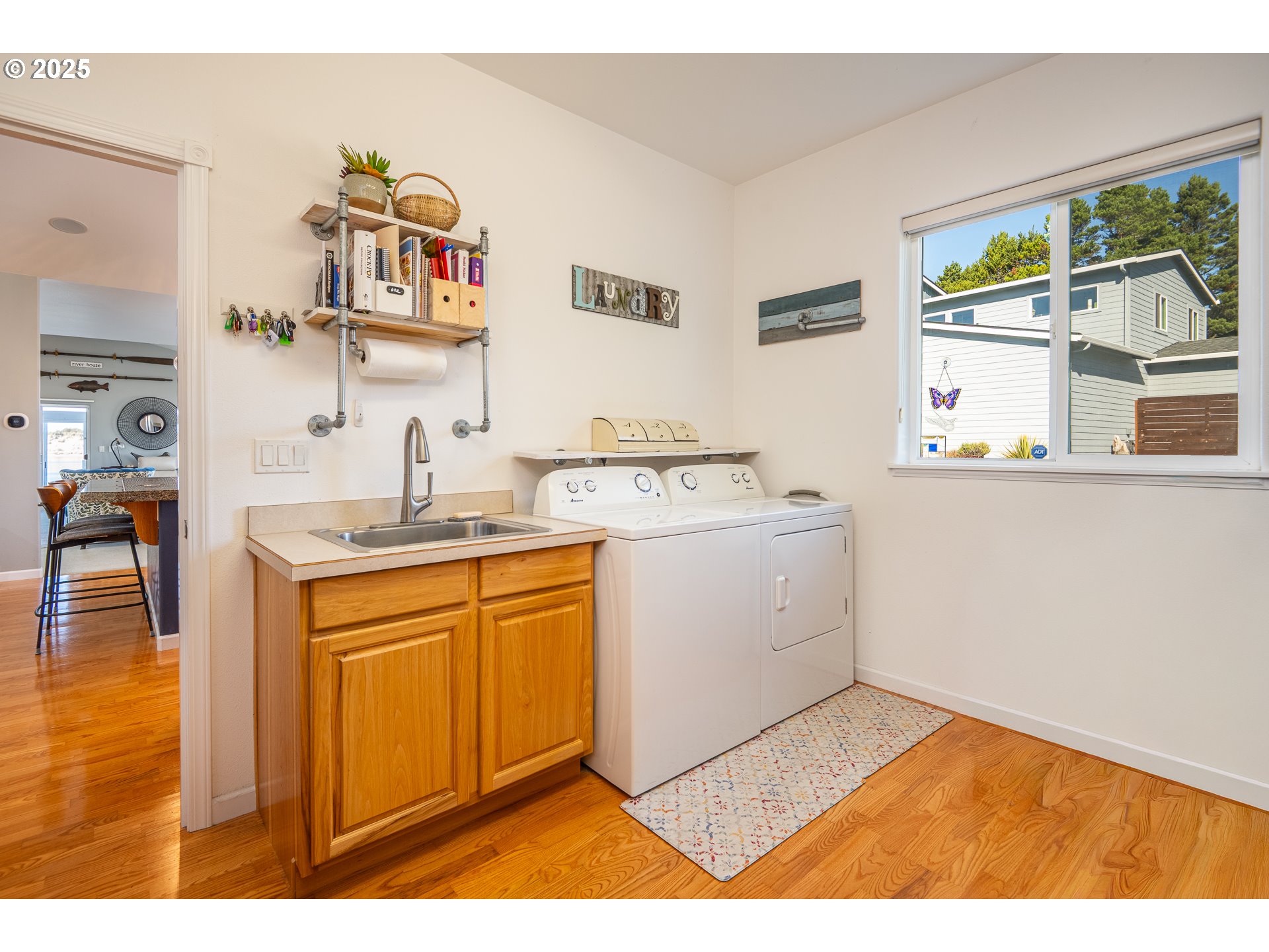 3315 Rhododendron Drive Florence, OR 97439 - Photo 24 of 48 a utility room with sink dryer and washer