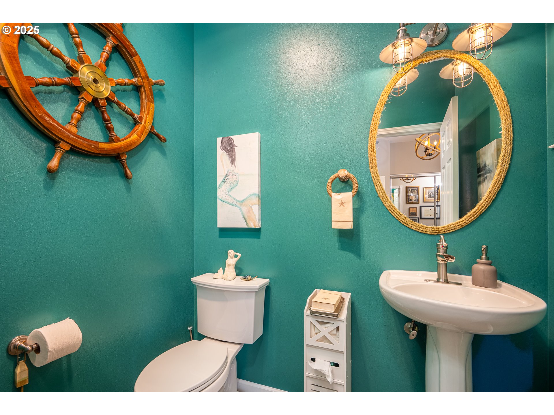 3315 Rhododendron Drive Florence, OR 97439 - Photo 25 of 48 a bathroom with a sink mirror and toilet