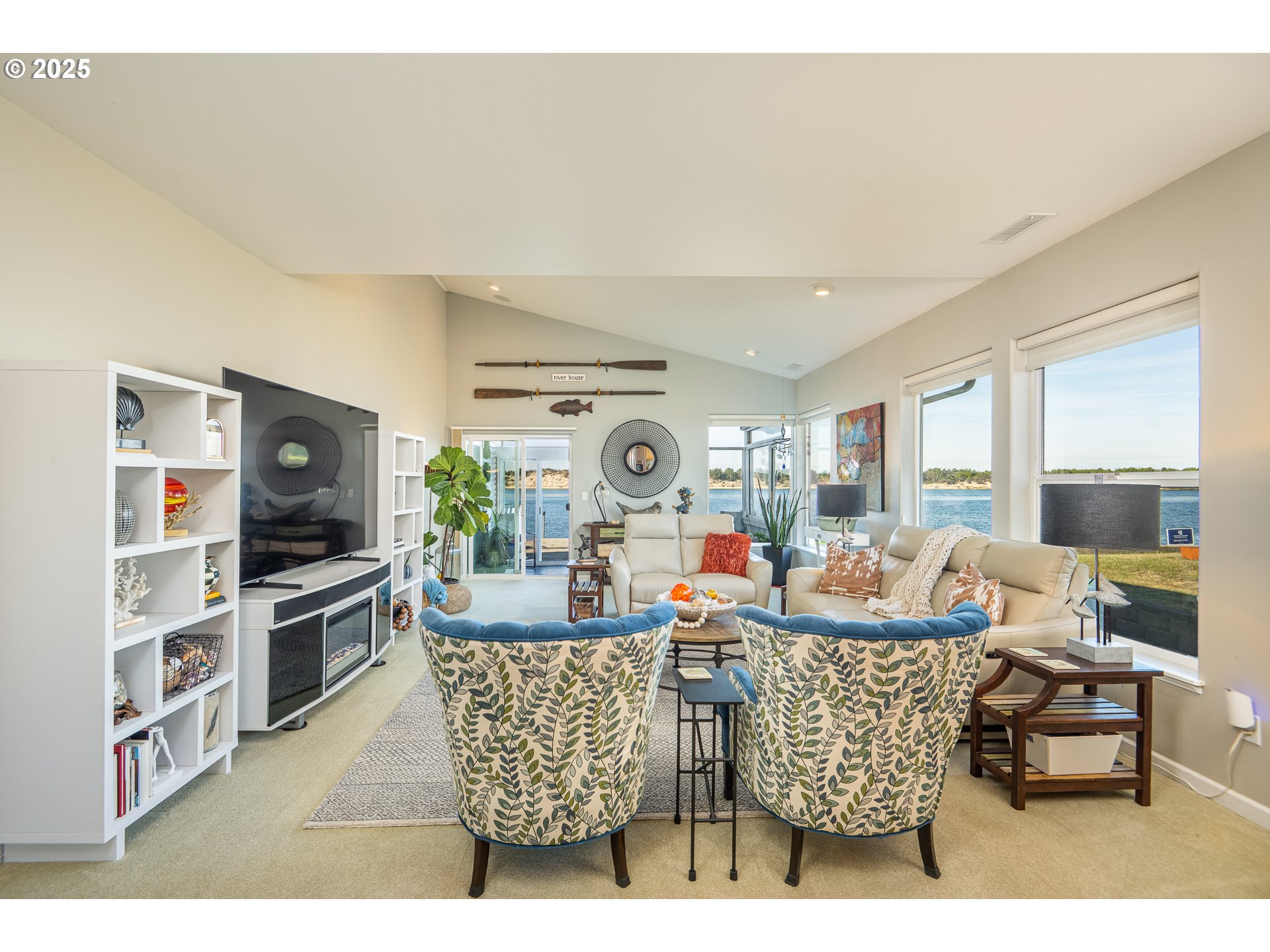 3315 Rhododendron Drive Florence, OR 97439 - Photo 26 of 48 a living room with fireplace furniture and a flat screen tv