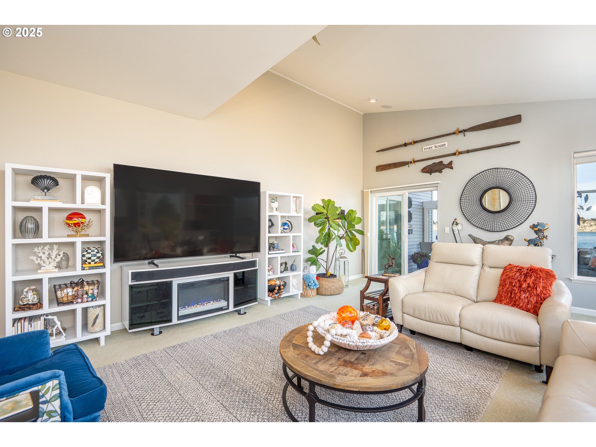 3315 Rhododendron Drive Florence, OR 97439 - Photo 27 of 48 a living room with furniture and a flat screen tv