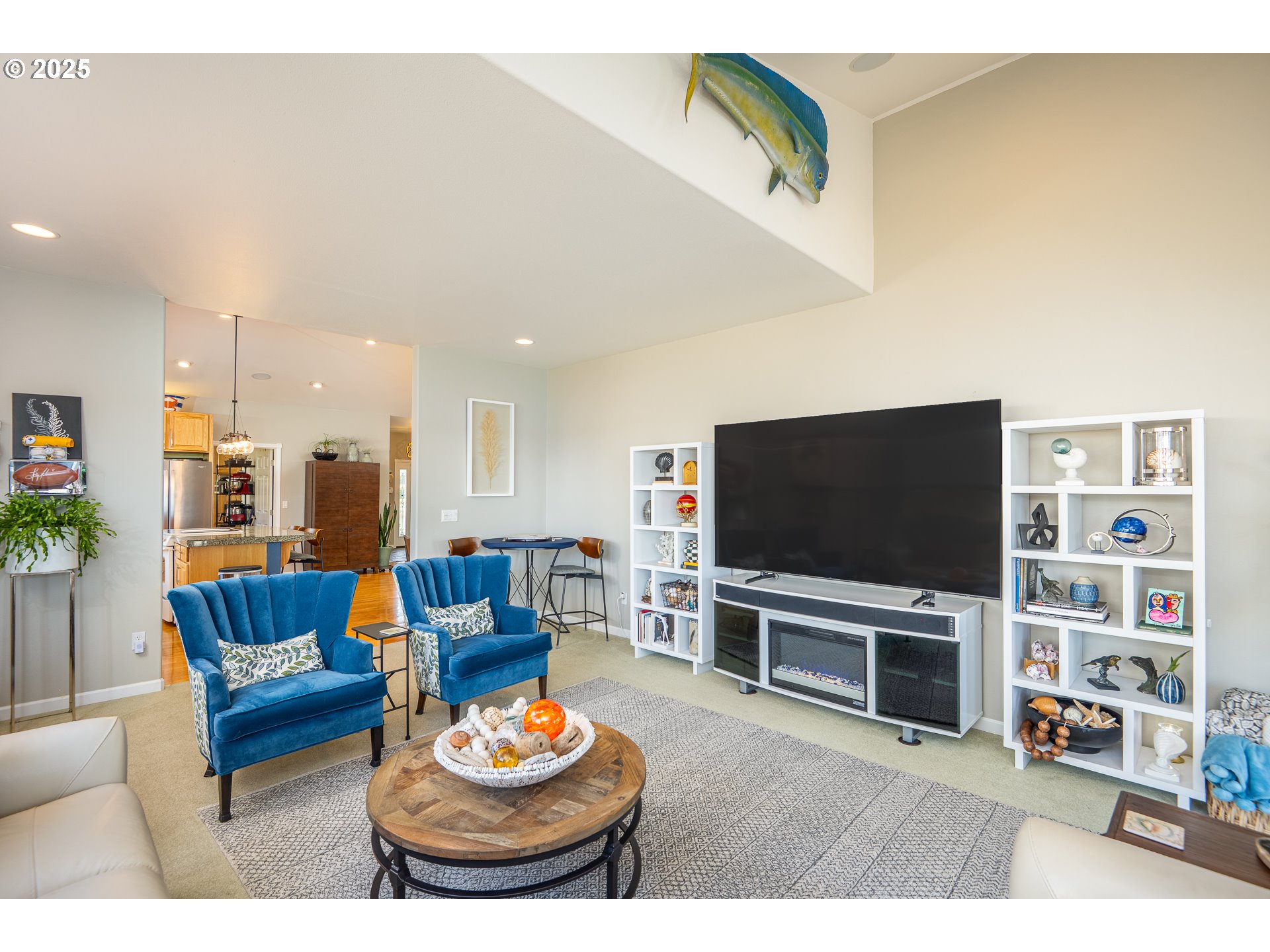 3315 Rhododendron Drive Florence, OR 97439 - Photo 29 of 48 a living room with furniture and a flat screen tv