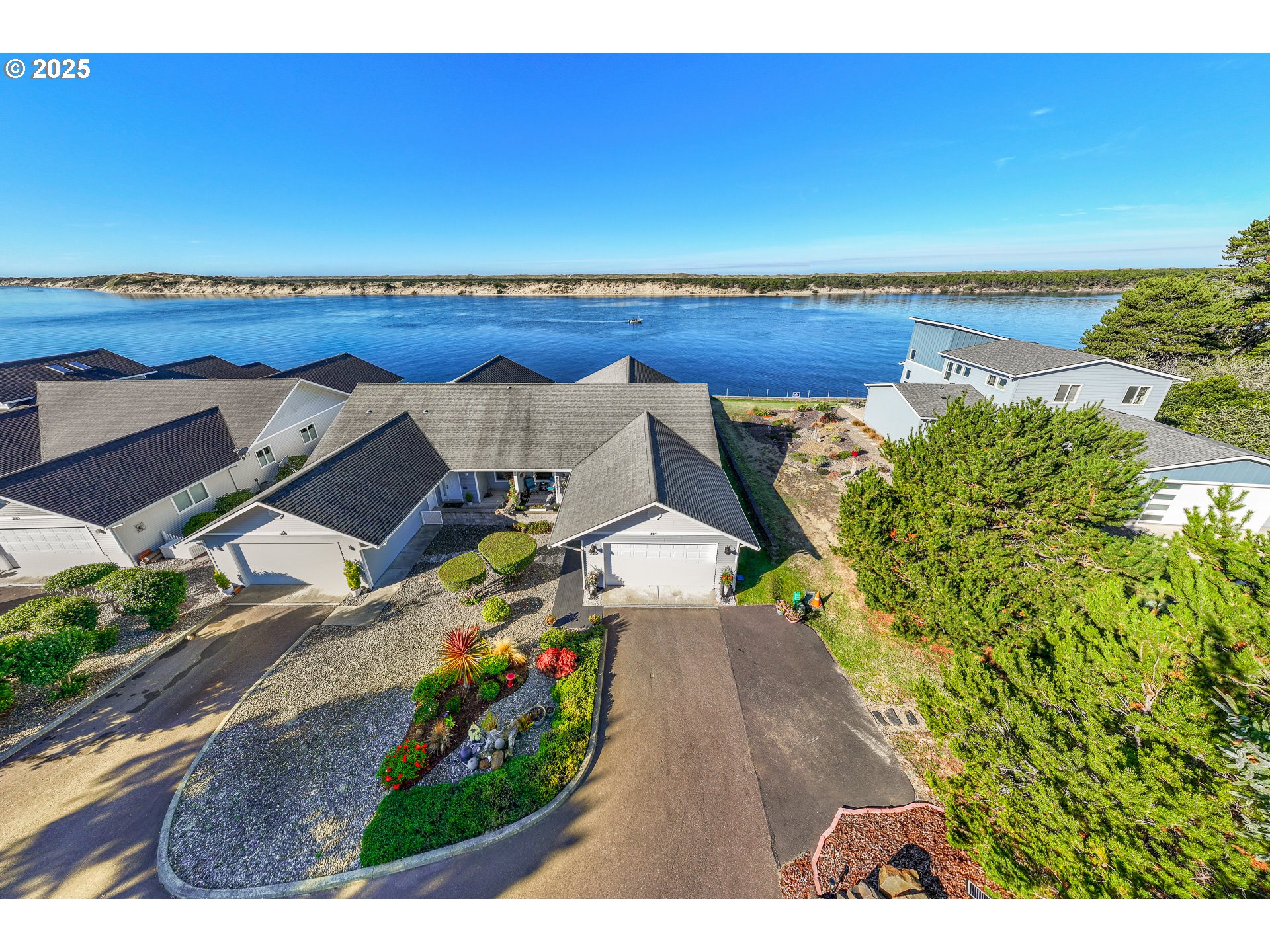 3315 Rhododendron Drive Florence, OR 97439 - Photo 3 of 48 an aerial view of a house with a garden