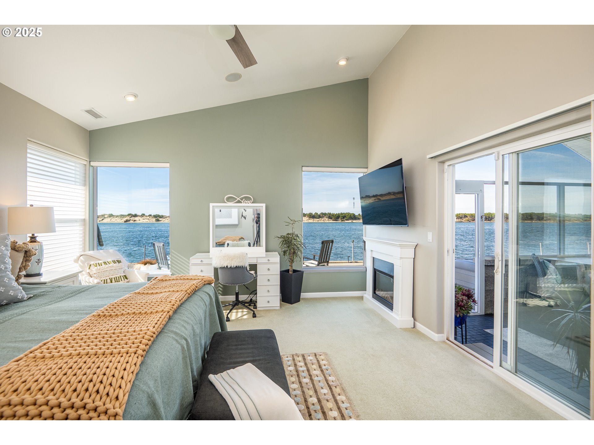 3315 Rhododendron Drive Florence, OR 97439 - Photo 32 of 48 a living room with furniture and a flat screen tv
