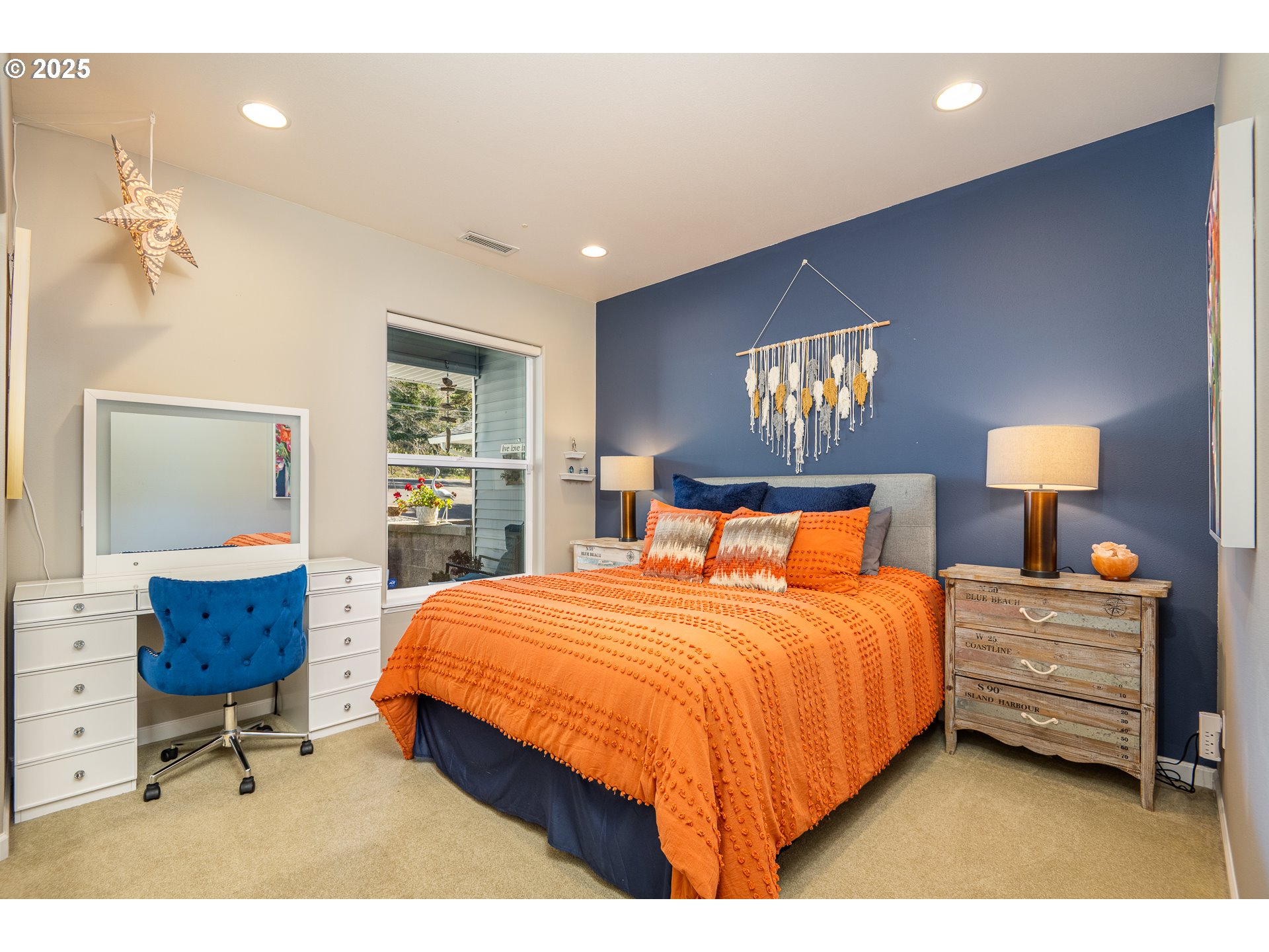 3315 Rhododendron Drive Florence, OR 97439 - Photo 40 of 48 a bedroom with a bed and a dresser in it