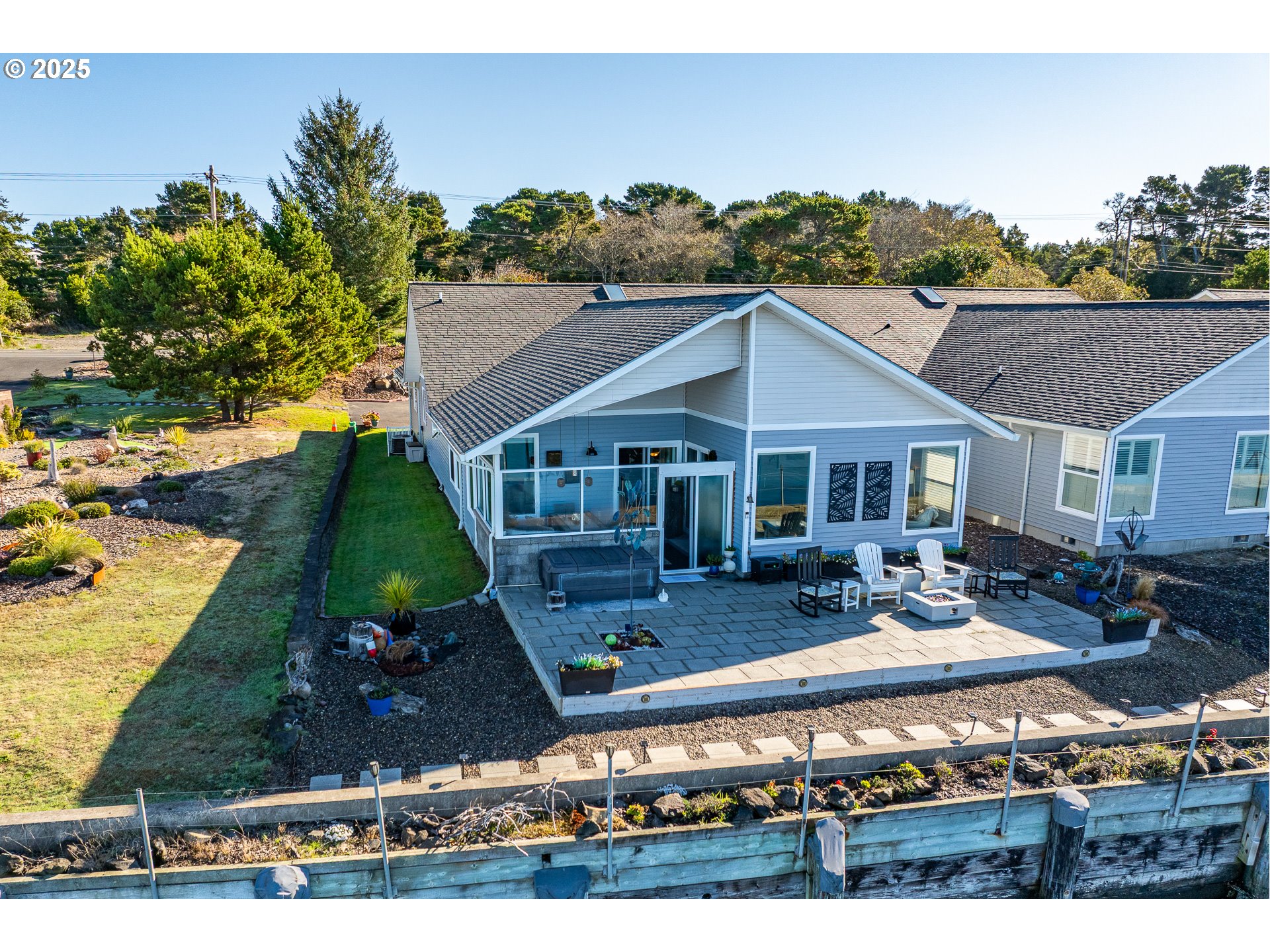 3315 Rhododendron Drive Florence, OR 97439 - Photo 4 of 48 a view of house with yard outdoor seating and covered in the background