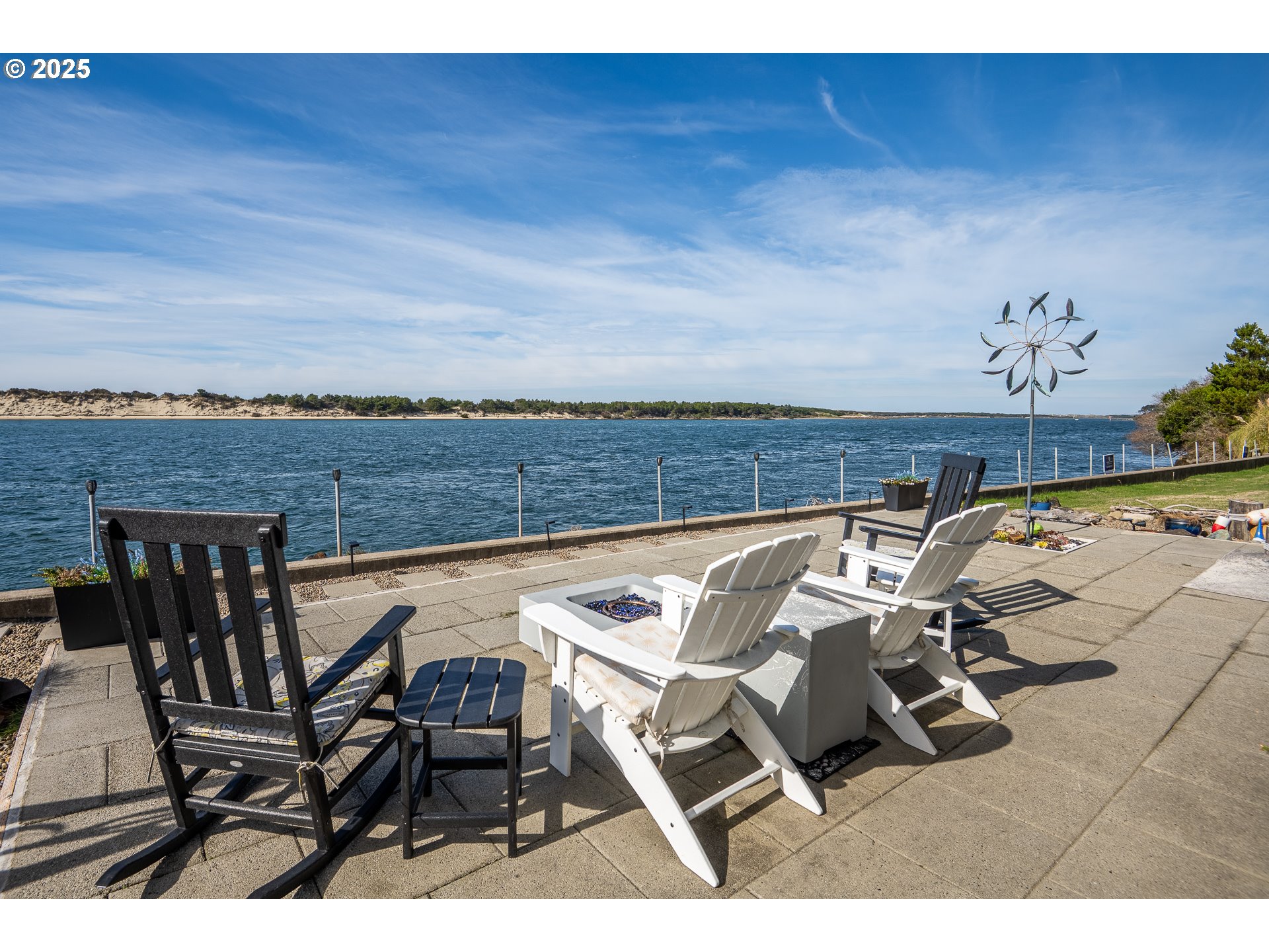3315 Rhododendron Drive Florence, OR 97439 - Photo 10 of 48 a view of a patio with table and chairs with wooden floor
