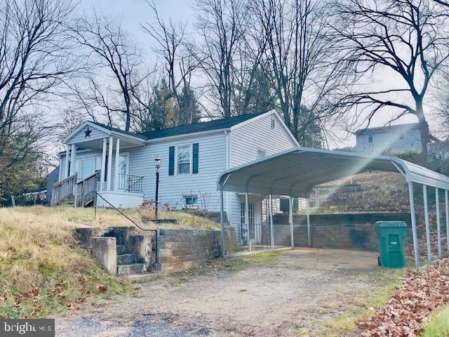 1312 East Main Street Luray, VA 22835 - Photo 2 of 3 a front view of house with yard outdoor seating and barbeque oven