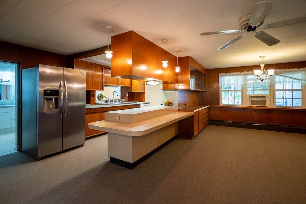 69 New Boston Road Sturbridge, MA 01566 - Photo 3 of 42 a large kitchen with stainless steel appliances a large counter top