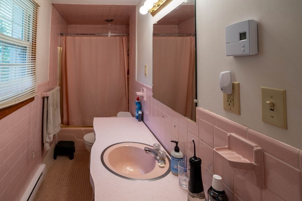 69 New Boston Road Sturbridge, MA 01566 - Photo 33 of 42 a bathroom with a sink a toilet and a mirror