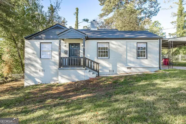 a front view of a house with a yard