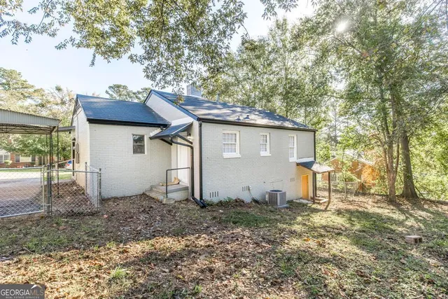 a house view with a backyard space