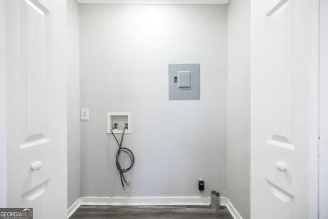 a view of door with wooden floor