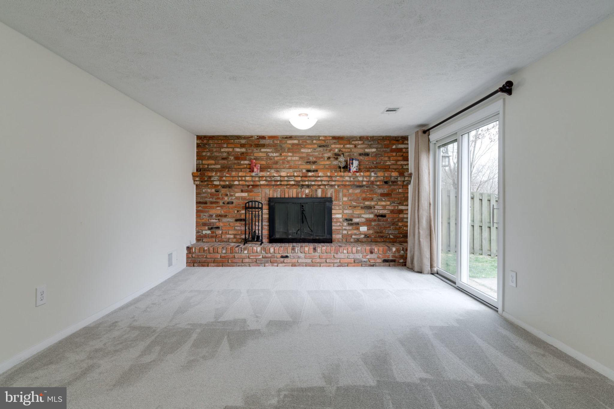 7759 Euclid Way Springfield, VA 22153 - Photo 44 of 65 Wood fireplace is wonderful on cool evenings