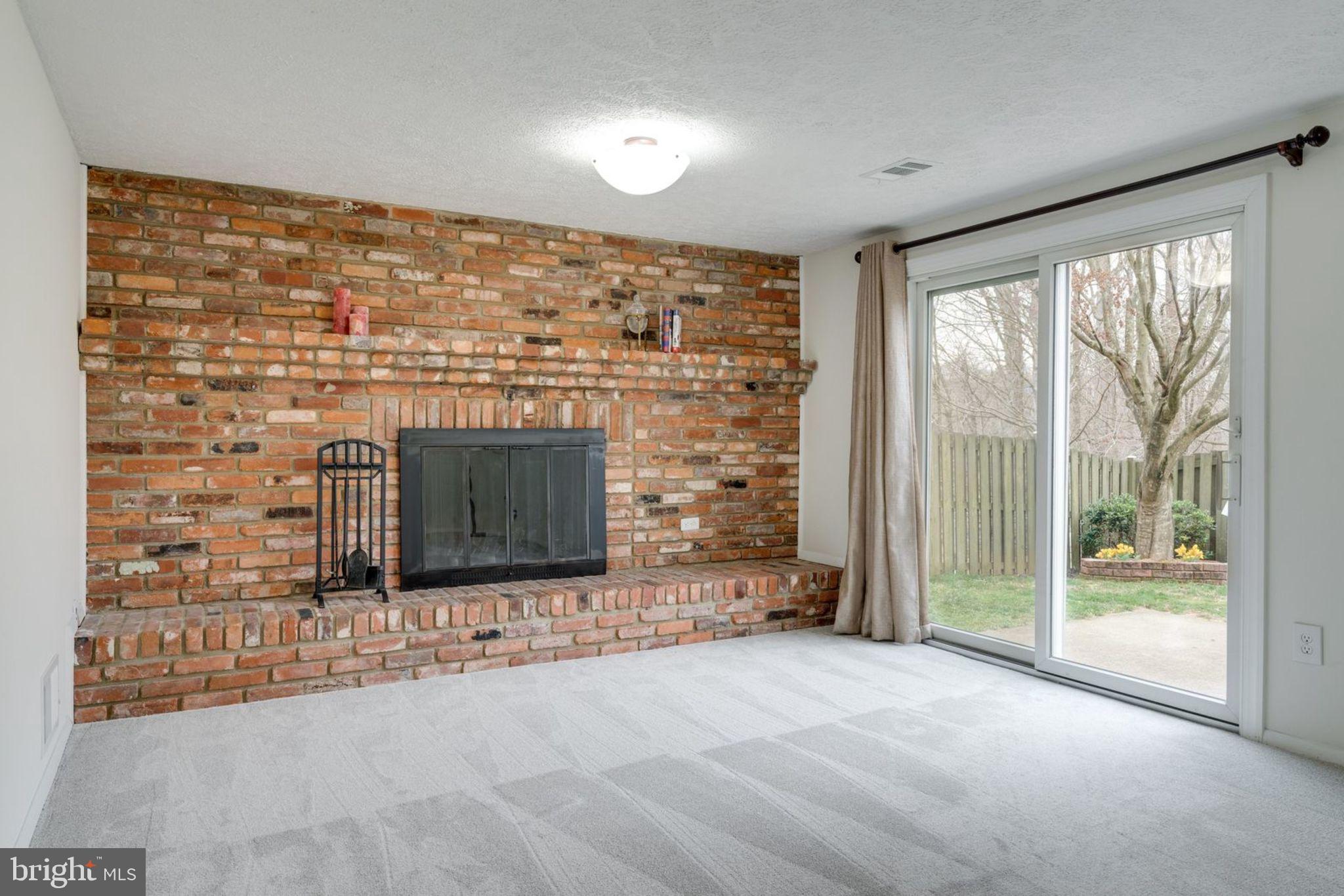 7759 Euclid Way Springfield, VA 22153 - Photo 46 of 65 Den with walkout to patio and fenced yard