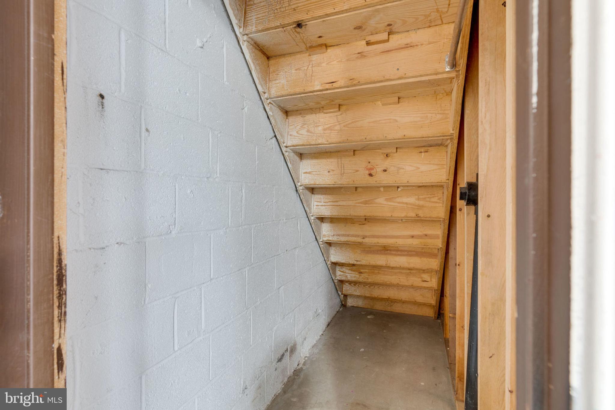 7759 Euclid Way Springfield, VA 22153 - Photo 50 of 65 Large storage area under basement steps