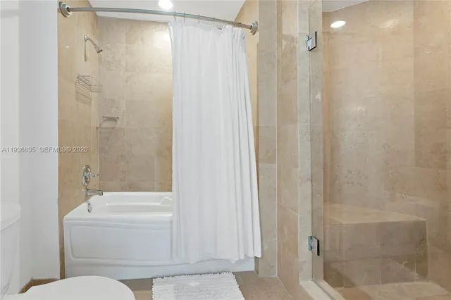 a bathroom with a shower and a toilet