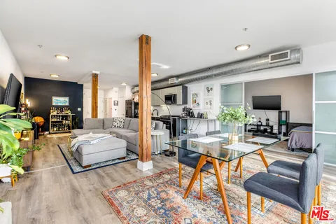 a living room with fireplace furniture and a flat screen tv