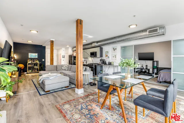 a living room with fireplace furniture and a flat screen tv