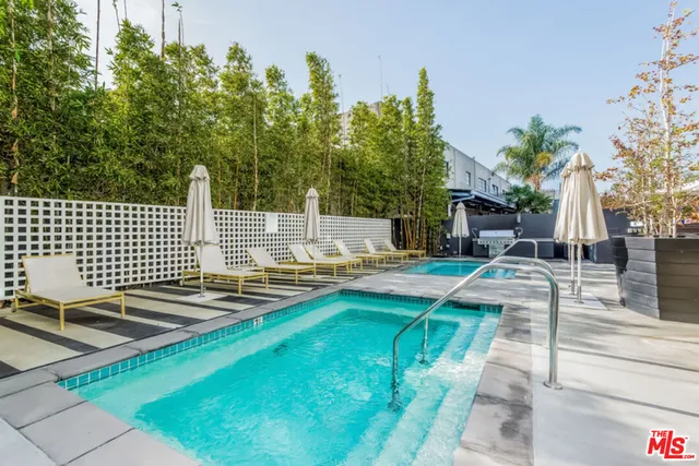 a view of a swimming pool with a patio