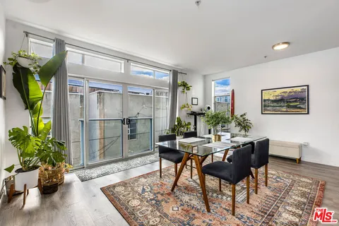 a workspace with furniture and a potted plant