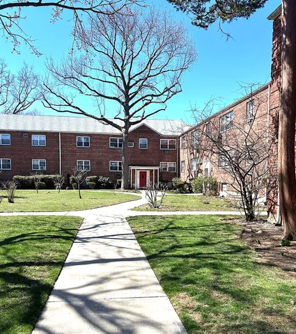 a house with garden in front of it